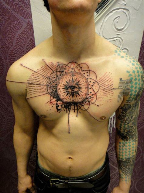 a human eye stares out from a mandala on this guy s chest