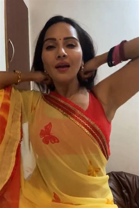 geetanjali mishra sexy cleavage and armpit though in orange sleevless saree