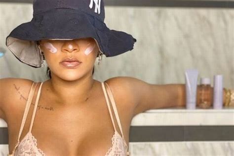 rihanna shows off huge chest tattoo as she poses in a lace