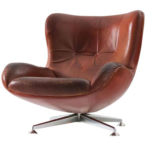 illum wikkelso swivel lounge chair  brown leather  sale  stdibs