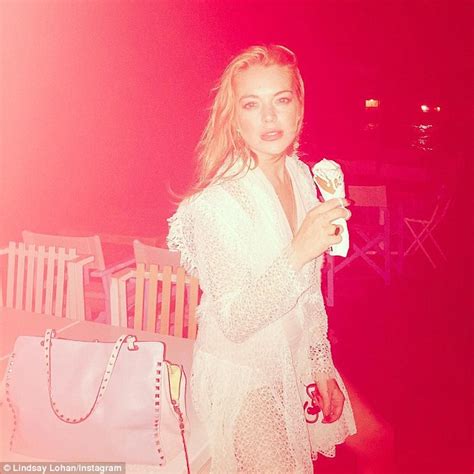 lindsay lohan rocks shredded jeans and white blouse on way to chiltern