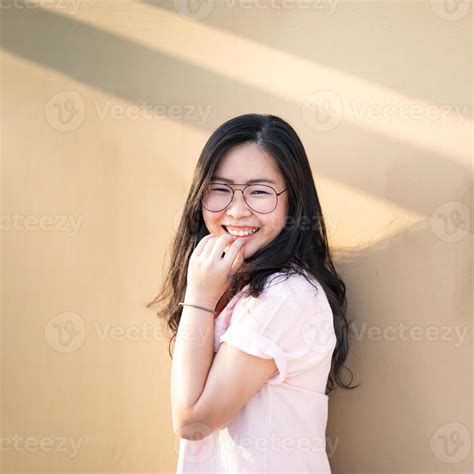 Young Glasses Asian Chinese Thai Girl Is Smiling And Happy On Rooftop