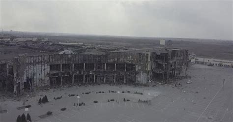 drone footage shows damaged shopping mall  residential buildings  mariupol cbs news