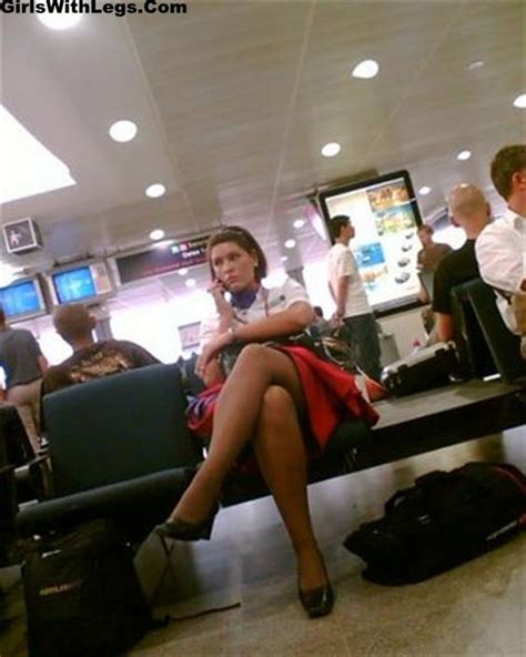 candid air hostess with crossed legs and tan pantyhose