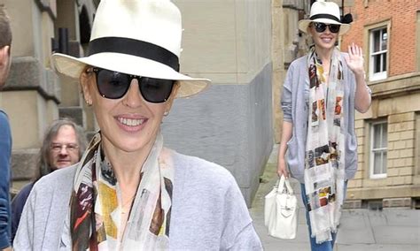 Kylie Minogue Cuts A Casual Figure In A Grey Oversized Cardigan As She