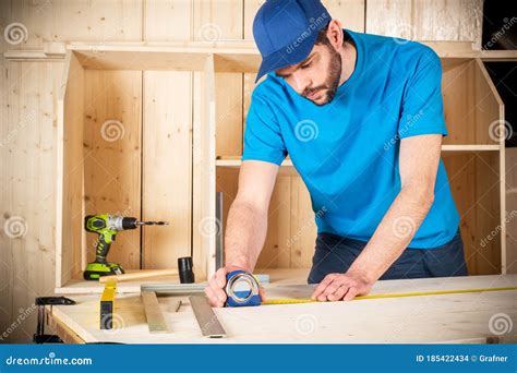carpenter   beard  standing   carpentry table  tools stock photography
