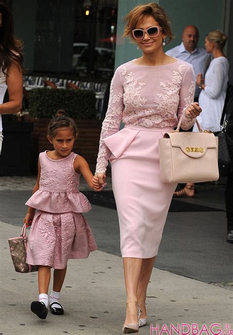 jennifer lopez and emme look pretty in pink with versace and gucci bags handbag du jour