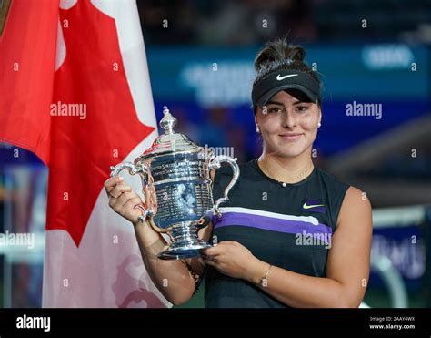 canadian tennis player bianca andreescu holding trophy during