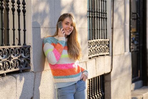pretty teenager chatting on the cell phone stock image