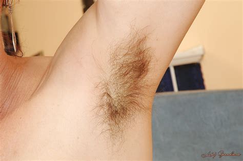 redhead mature lady stripping and exposing her hairy armpits and bushy cunt