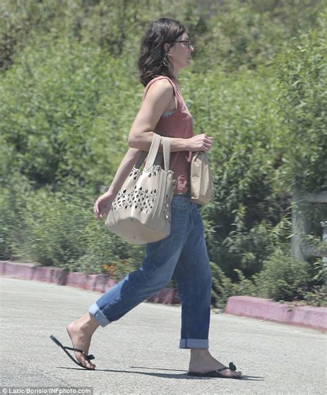 Milla Jovovich Uses Her Supermodel Skills To Strut Her Supermarket