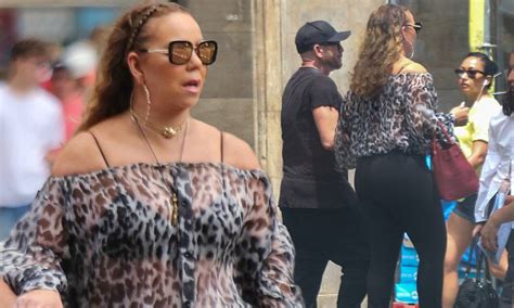 mariah carey shows off her ample curves in sheer blouse daily mail online