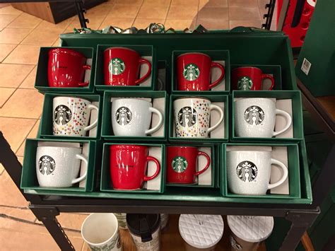 starbucks mugs  arranged   green tray