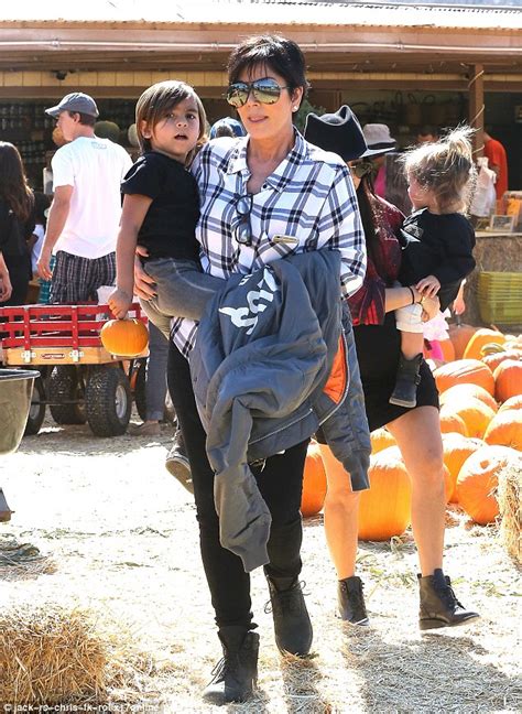 kim kardashian cradles north as she visits the pumpkin patch with