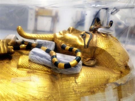 tutankhamun s gilded coffin leaves its tomb for the first time since