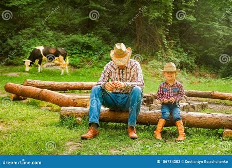 happy child  cowboy parent  nature   field stock image