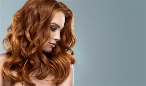 Red Haired Woman With Voluminous Shiny And Curly Hairstyle Flying Hair