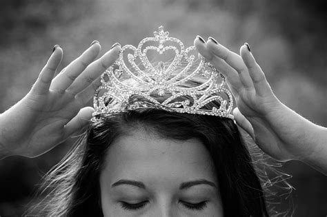 woman holding silver colored crown queen crowning luxury princess