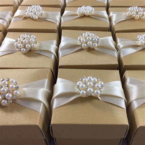 golden wedding favour box  cream ribbon featuring pearl brooch