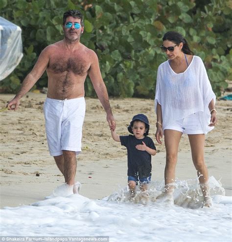 simon cowell and lauren silverman enjoy a stroll with son eric in