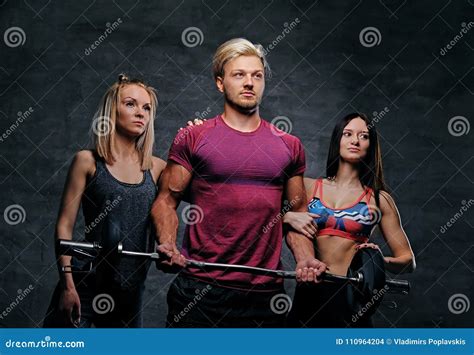 Threesome Fitness Model Of Blond And Brunette Slim Women And A M Stock
