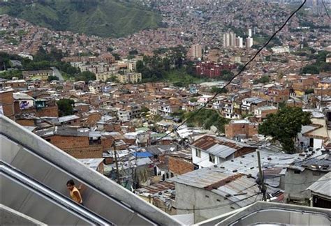 outdoor escalator opens in medellin slum in colombia ritemail