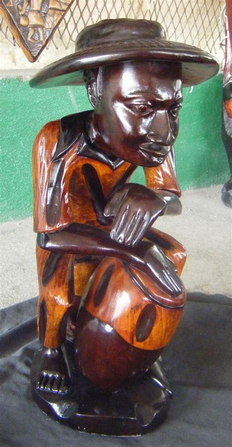 haitian man  drum wooden sculpture statue figurine haiti  usd globebids