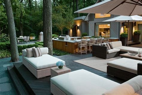 outdoor kitchen and living spaces in the center of the space is a fully functional kitchen that