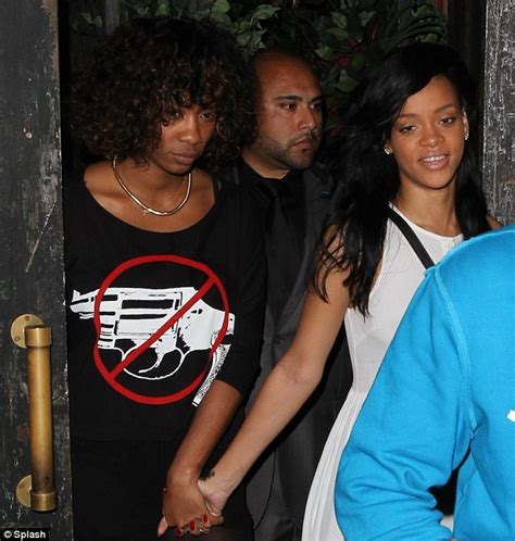 rihanna reveals her chipped manicure as she makes rude hand gesture alongside bff melissa forde