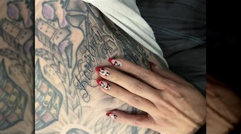 travis barker s tattoo of kourtney s name doesn t mean