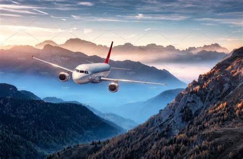 airplane  flying  mountains stock photo  airplane  aircraft transportation
