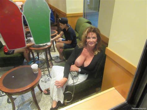 lovely deauxma flashing her big tits on vacation 16 photos