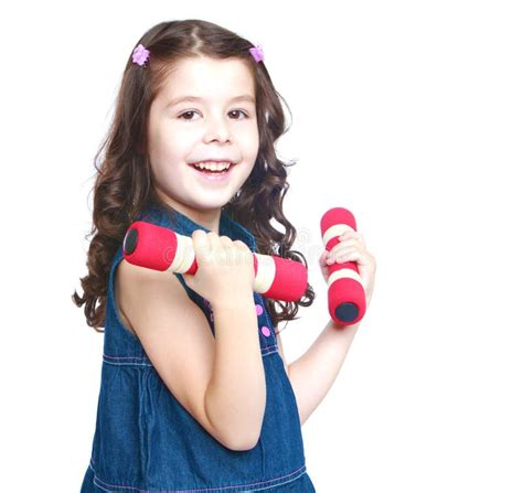 adorable  girl holding  dumbbell close  stock image image