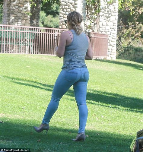 Hilary Duff Sports Toned Muscles In Low Cut Tank And