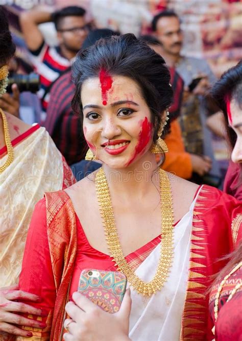 photo about a beautiful girl wearing bengali traditional saree and