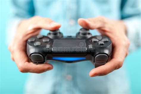 male hands holding  gaming controller stock image image  hand