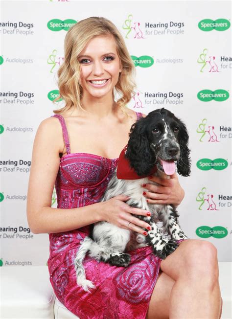 rachel riley teases cleavage in low cut dress as she poses