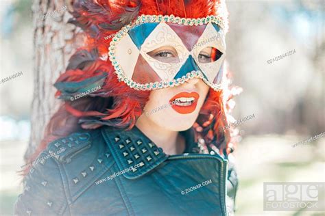Carnival Redhead Woman With Venetian Style Mask With Red Feathers And