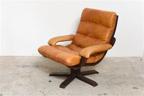 nordic cognac leather swivel lounge chair  sale  pamono