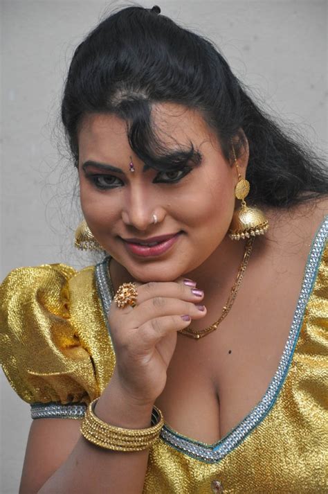 doodhwali mallu aunty showing hot bulging milktanks in low cut golden blouse actress photos