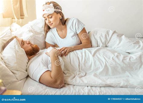 Adorable Caucasian Woman Look At Sleeping Man With Love Stock Image