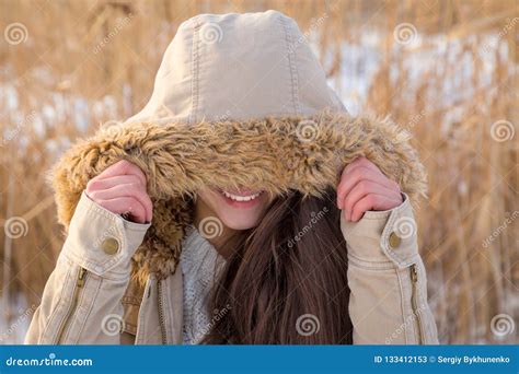 cute girl hiding  face  hood stock image image  happy hide