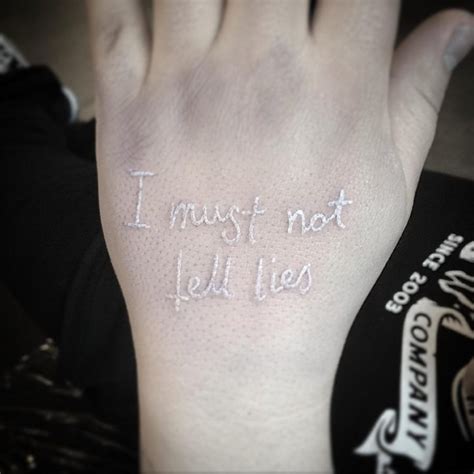 white lettering tattoo on hand best tattoo ideas gallery