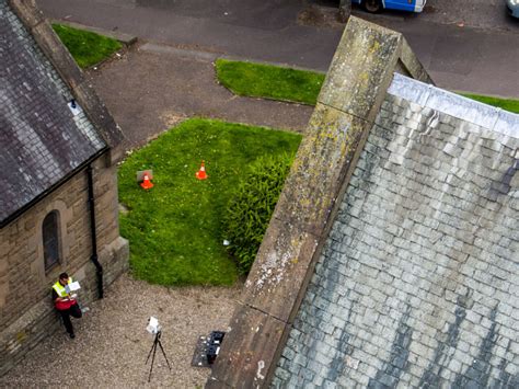 inspecting church spires   drone risingview