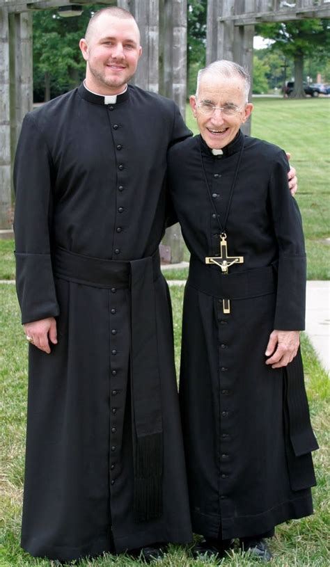 catholic priests black cassock wearing black priest outfit black