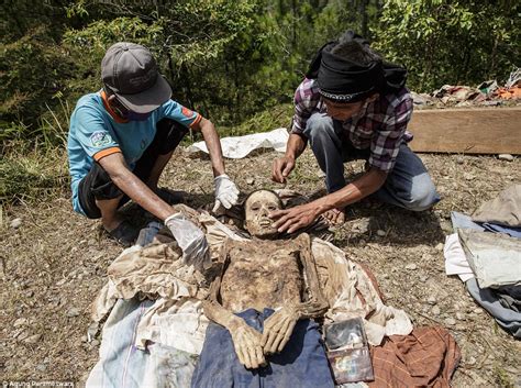 Photos In Indonesia People Dig Up Dead Relatives For