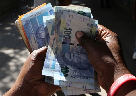 south africas rand drops  firm dollar muted reaction  central