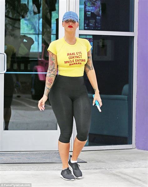 amber rose highlights her incredible curves in skintight leggings and a cheeky slogan tee