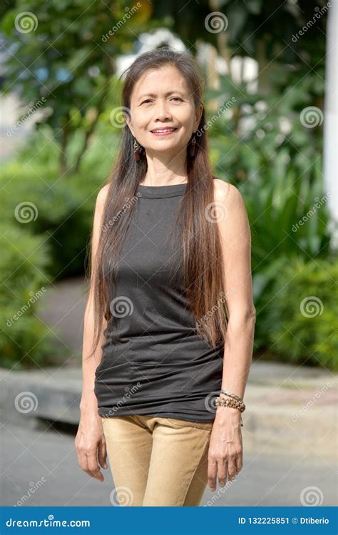 smiling filipina female senior stock image image of adult female