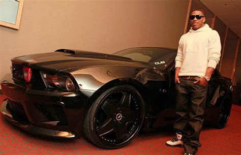 mannie fresh 30 photos of rappers flexing with giant car rims complex